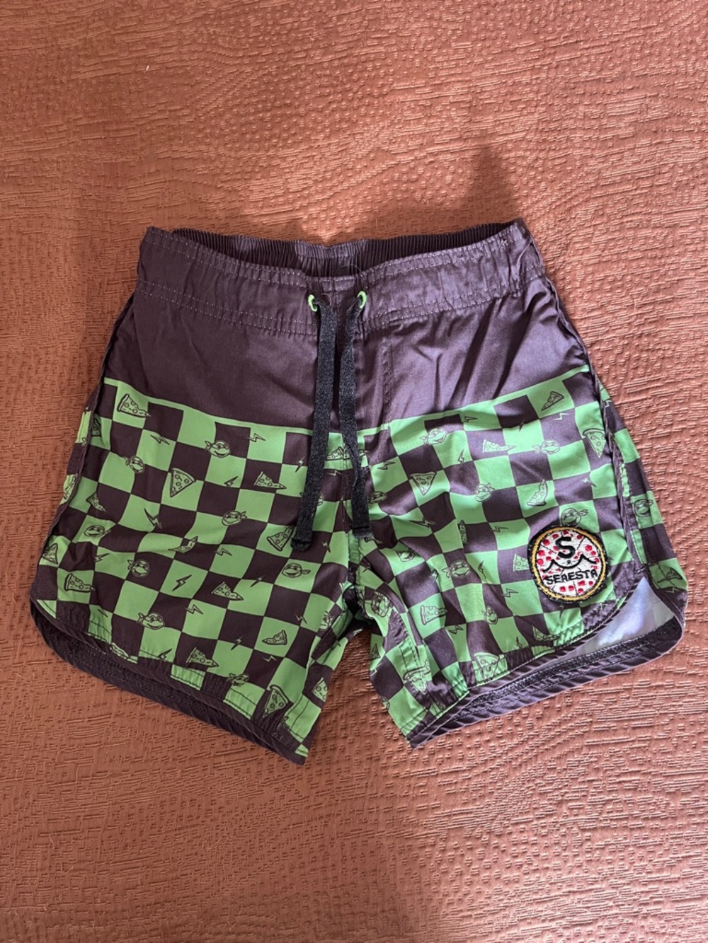 Kids Checkerboard TMNT Green and Black Swim Trunks with Patch Detail